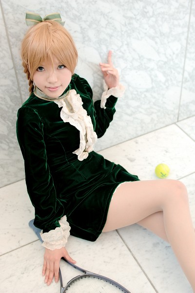 1girl asian ball blonde_hair blue_eyes braid color_contacts cosplay dress female_focus green_dress kipi-san looking_at_viewer maki_saori_(swk) maki_saori_(swk)_(cosplay) mole nylons on_floor photo_(medium) racket short_dress sitting smash_wo_kimero! solo tennis_ball tennis_racket twin_braids velvet_dress