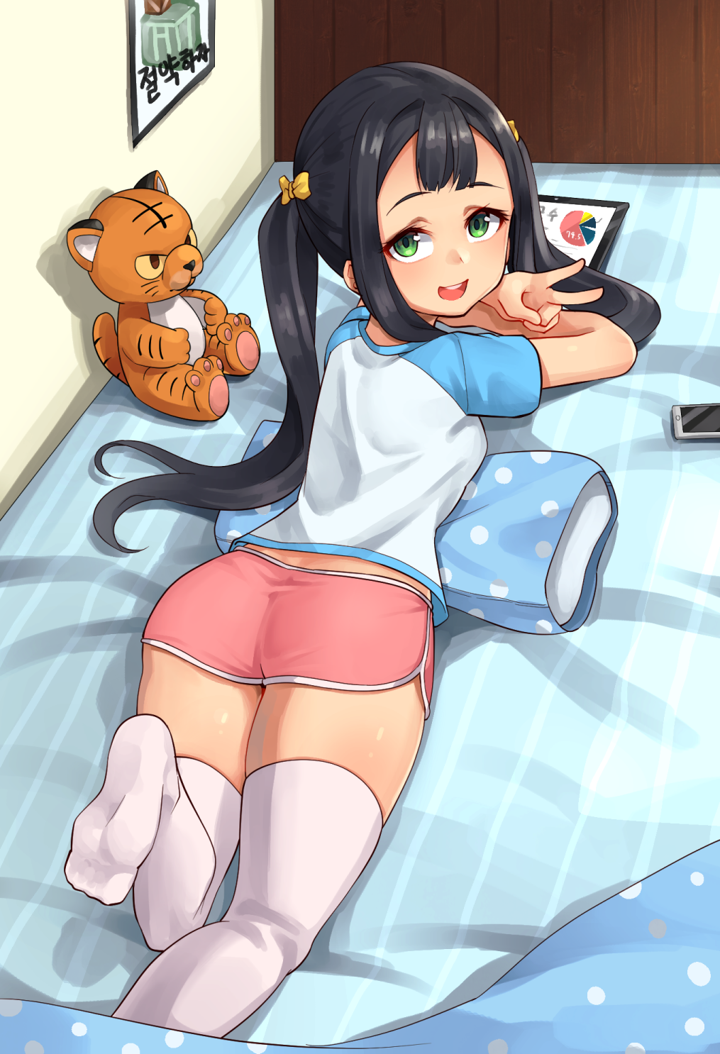 1girl ajidot andvari_(last_origin) ass black_hair bow dolphin_shorts from_behind green_eyes hair_bow highres last_origin long_hair looking_at_viewer looking_back lying on_bed on_stomach open_mouth short_shorts shorts smile solo stuffed_animal stuffed_tiger stuffed_toy tablet_pc thighhighs twintails v white_thighhighs