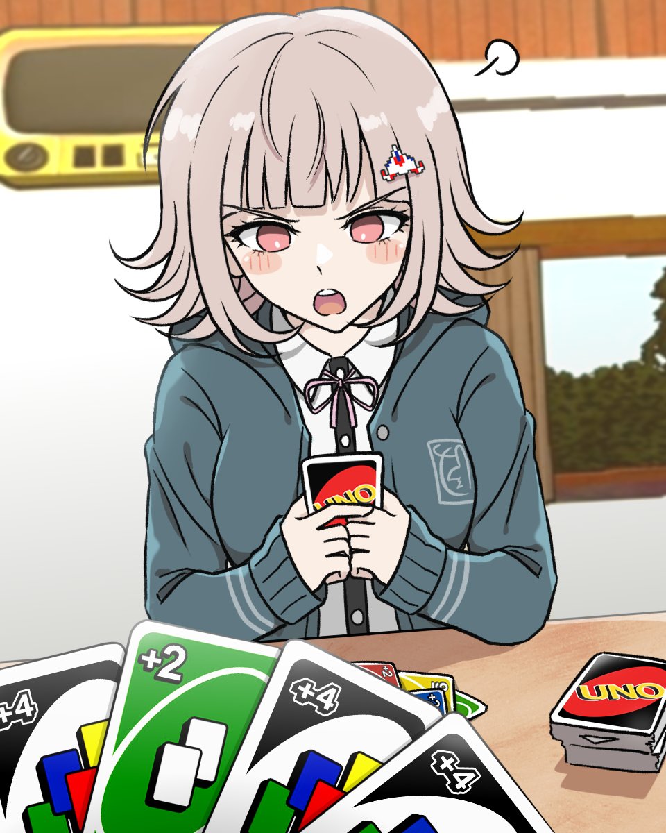 1girl :o black_jacket black_shirt blush brown_hair card collared_shirt danganronpa_(series) danganronpa_2:_goodbye_despair dress_shirt flipped_hair galaga hair_ornament highres holding holding_card indoors jacket kmnm_1403 long_sleeves medium_hair nanami_chiaki neck_ribbon open_clothes open_jacket pink_eyes pink_ribbon playing_card ribbon shirt solo table uno_(game) upper_body white_shirt window