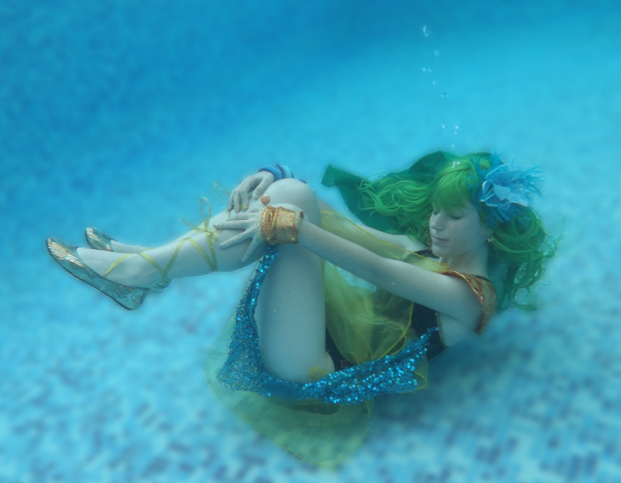 1girl air_bubble bubble closed_eyes cosplay earrings female_focus final_fantasy final_fantasy_iv green_hair jewelry long_hair photo_(medium) rydia_(ff4) rydia_(ff4)_(cosplay) solo summoner underwater