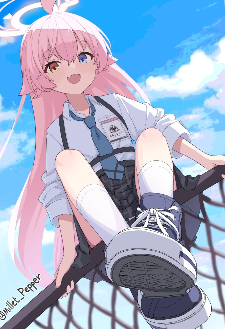 1girl :d abydos_high_school_logo ankle_socks blue_archive blue_eyes blue_footwear blue_necktie blue_sky chain-link_fence fang fence from_below grey_skirt hair_between_eyes hair_flaps halo heterochromia hoshino_(blue_archive) long_hair looking_at_viewer millet_pepper necktie on_fence open_mouth pink_hair pink_halo plaid_clothes plaid_skirt pleated_skirt shoes sitting skin_fang skirt sky smile sneakers socks solo twitter_username white_socks yellow_eyes