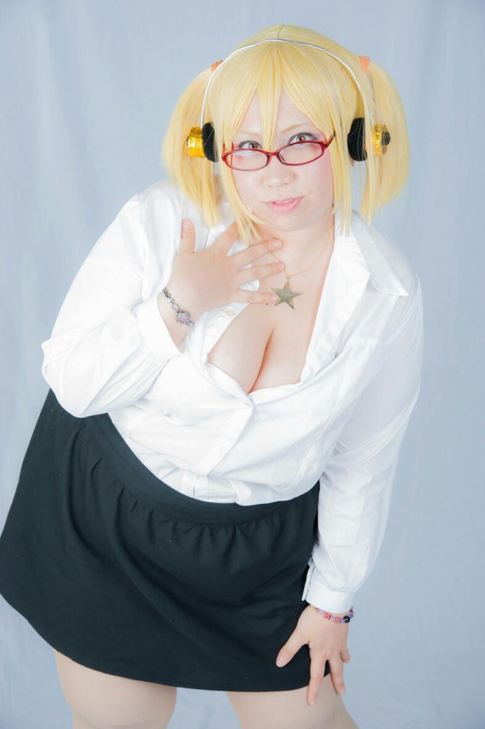 1girl asian blonde_hair cosplay fat female_focus headphones kouya nitroplus photo_(medium) solo super_pochaco super_pochaco_(cosplay)