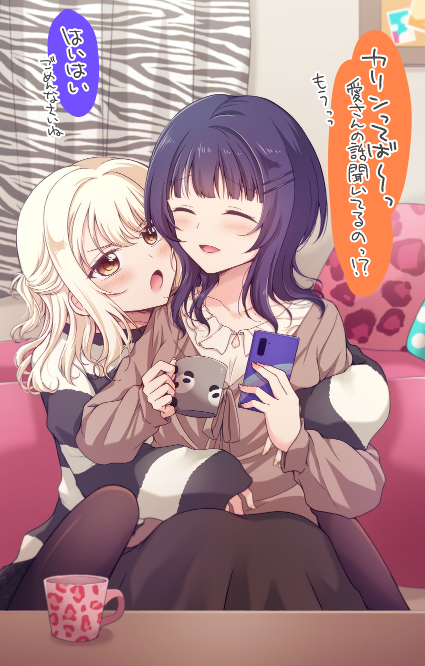 2girls asaka_karin between_legs blonde_hair blush cellphone closed_eyes coffee_mug commentary_request cup cushion highres holding holding_phone hug hug_from_behind indoors kuroda_roku_(345) long_hair love_live! love_live!_nijigasaki_high_school_idol_club miyashita_ai mug multiple_girls open_mouth parted_lips phone purple_hair red_eyes sitting smartphone smile speech_bubble striped_clothes striped_sweater sweater translation_request yuri