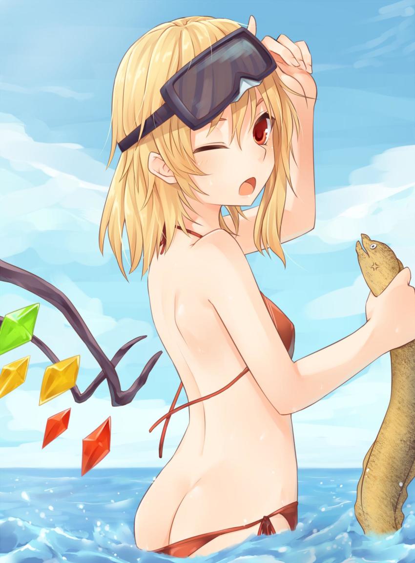 1girl animal arm_up ass bare_arms bare_shoulders bikini blonde_hair blue_sky blush breasts butt_crack cloud commentary_request cowboy_shot crystal day eel female_focus flandre_scarlet goggles goggles_on_head hair_between_eyes halterneck highres holding holding_animal long_hair looking_at_viewer miyo_(ranthath) moray_eel no_headwear one_eye_closed one_side_up open_mouth outdoors red_bikini red_eyes side-tie_bikini_bottom sky small_breasts solo standing swimsuit touhou untied_bikini wading water wings