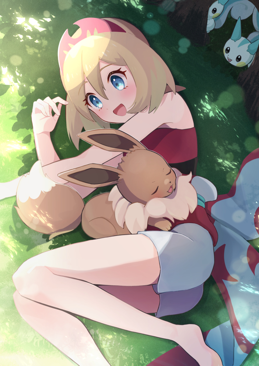 1girl :d barefoot blonde_hair commentary_request creatures_(company) day eevee eyelashes from_above game_freak gen_1_pokemon gen_4_pokemon green_eyes hairband happy haru_(haruxxe) highres irida_(pokemon) legs lying nintendo on_side open_mouth outdoors pachirisu pokemon pokemon_(creature) pokemon_legends:_arceus sash shadow shirt shorts smile tongue waist_cape