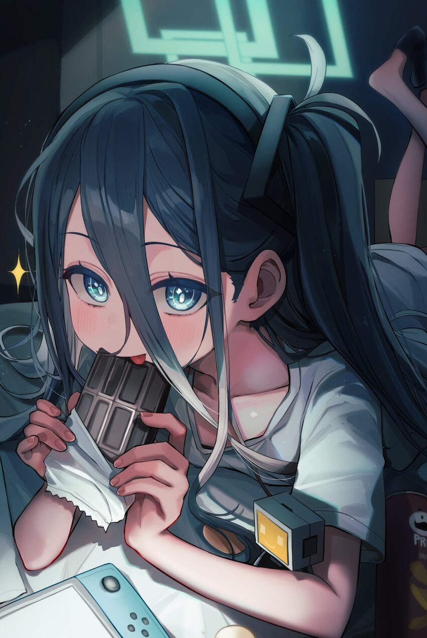 1girl absurdres aqua_halo aris_(blue_archive) black_hair blanc_(whit_blanc) blue_archive blue_eyes candy chocolate chocolate_bar collarbone fingernails food hair_between_eyes halo handheld_game_console highres holding holding_chocolate holding_food looking_at_viewer lying nintendo_switch on_stomach shirt solo white_shirt