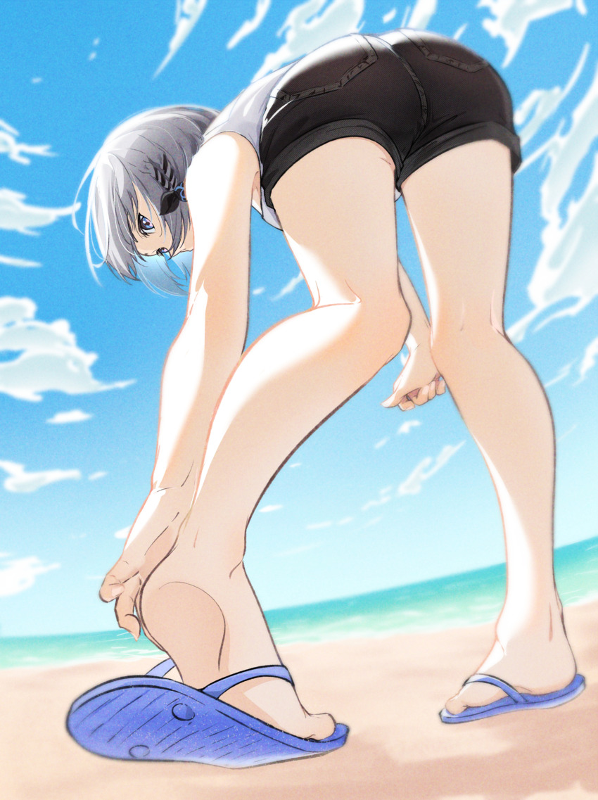 1girl arakuremono ass bare_arms bare_legs beach black_shorts blue_footwear blue_sky braid cloud feet flip-flops from_behind from_below grey_hair hand_on_own_foot highres holoh3roes hololive hololive_indonesia kneepits looking_down ocean sand sandals shirt short_hair short_shorts shorts sky sleeveless sleeveless_shirt soles toes vestia_zeta virtual_youtuber white_shirt