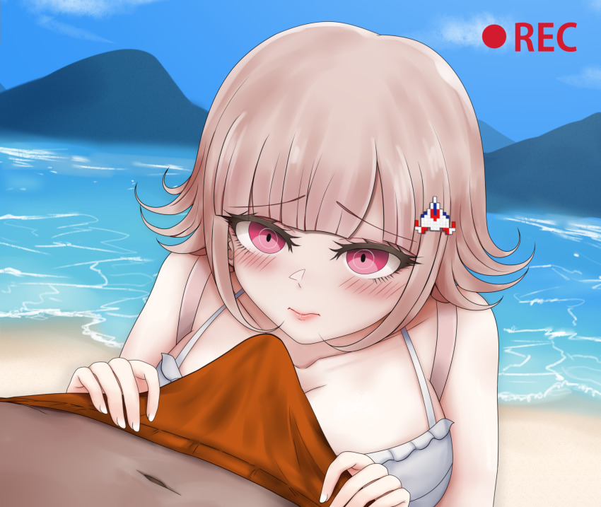 1boy 1girl 7cs_(congchuabuoito) backpack bag beach blush breasts brown_hair bulge closed_mouth collarbone danganronpa_(series) danganronpa_2:_goodbye_despair day flipped_hair galaga hair_ornament highres large_breasts looking_at_viewer male_swimwear medium_hair nanami_chiaki navel orange_male_swimwear outdoors pink_eyes recording upper_body water