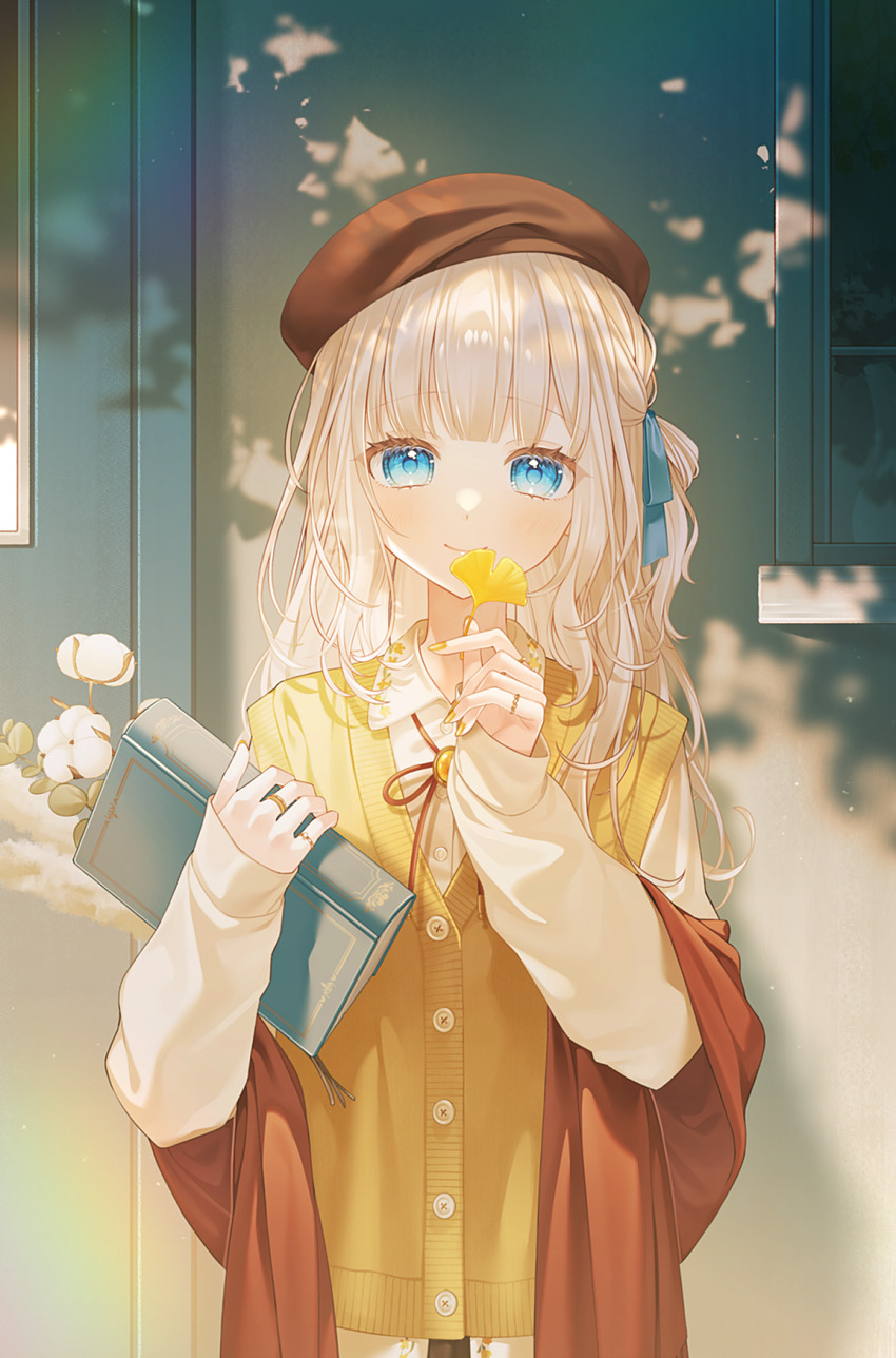 1girl autumn beret blonde_hair blue_eyes blue_ribbon blunt_bangs book bookmark brown_hat brown_shawl cardigan_vest collared_shirt commentary dappled_sunlight flower ginkgo_leaf hair_ribbon hat highres holding holding_book holding_leaf jewelry kannagi_aohi leaf long_hair looking_at_viewer original ribbon ring shawl shirt sleeves_past_wrists smile solo straight-on string_bowtie sunlight upper_body vest white_flower yellow_shirt yellow_vest