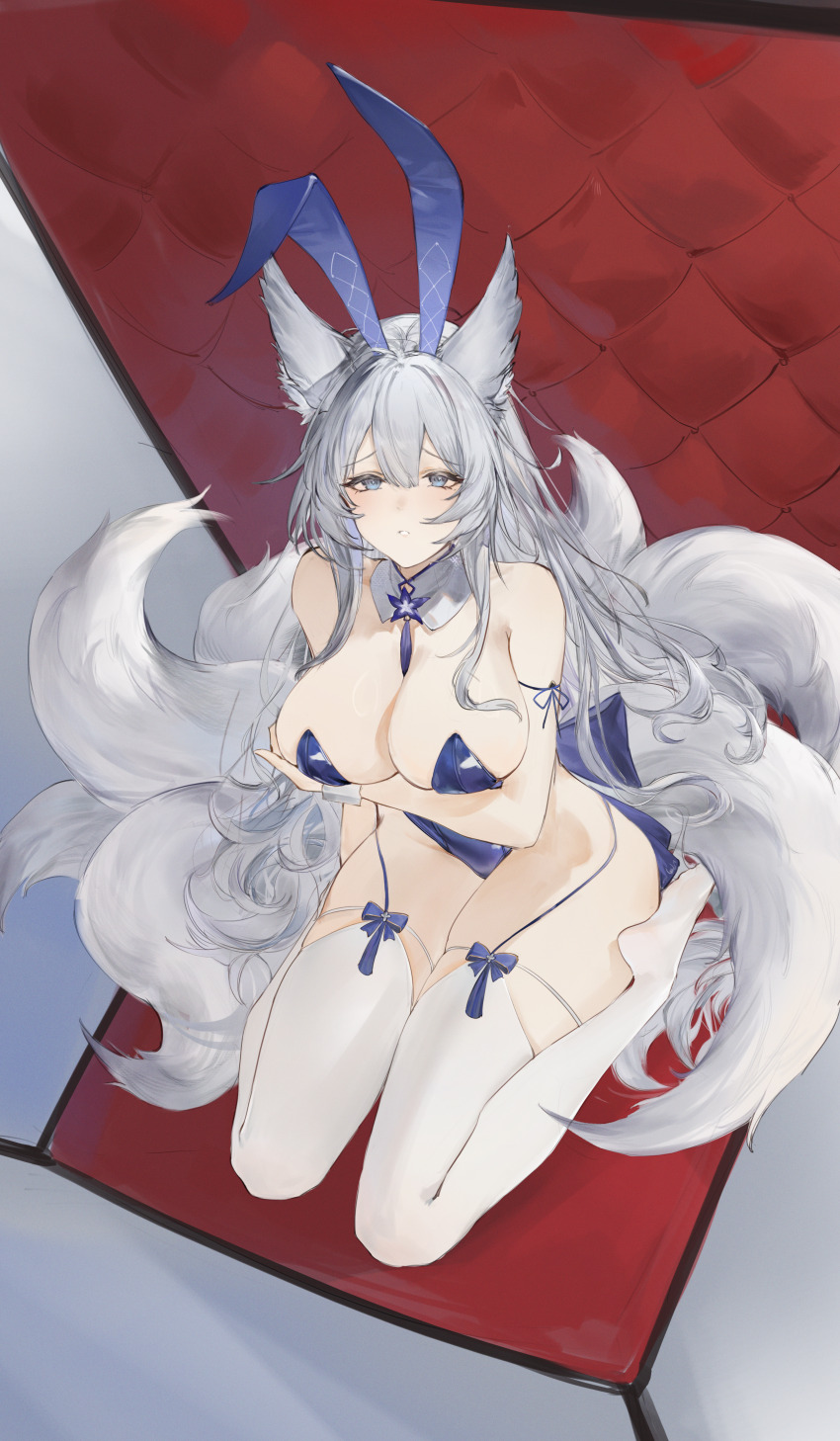 1girl absurdres animal_ear_fluff animal_ears arm_under_breasts azur_lane bare_shoulders between_breasts blue_eyes blue_leotard breasts cleavage closed_mouth detached_collar fake_animal_ears flantia fox_ears fox_tail garter_straps grey_hair hair_between_eyes highleg highleg_leotard highres huge_breasts leotard long_hair looking_at_viewer looking_up multiple_tails playboy_bunny rabbit_ears shinano_(azur_lane) sitting solo tail thighhighs very_long_hair wariza white_thighhighs