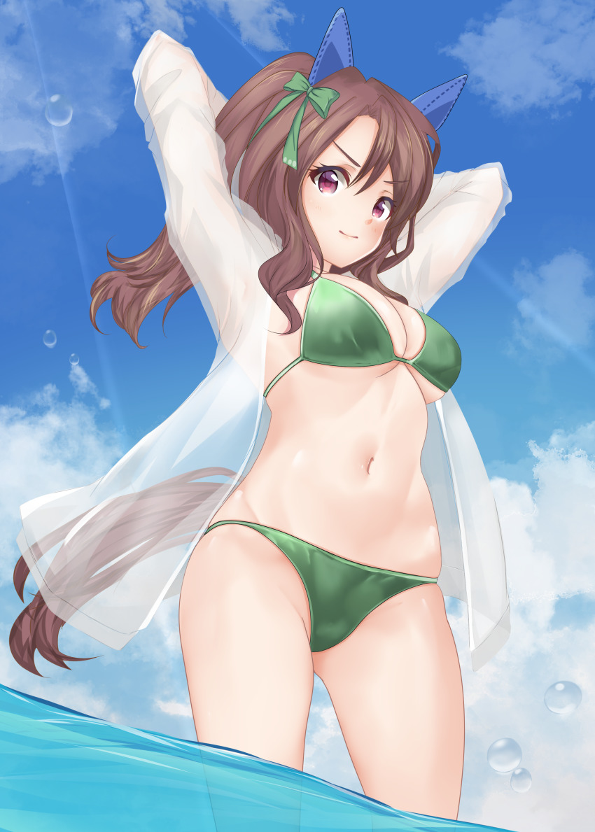 1girl absurdres animal_ears arms_behind_head bikini bow breasts brown_hair cleavage commentary_request cowboy_shot ear_covers from_below green_bikini hair_bow highres horse_ears horse_girl horse_tail jacket king_halo_(umamusume) long_hair looking_at_viewer medium_breasts navel osashimisan ponytail red_eyes see-through_clothes soaking_feet solo standing swimsuit tail umamusume wading water