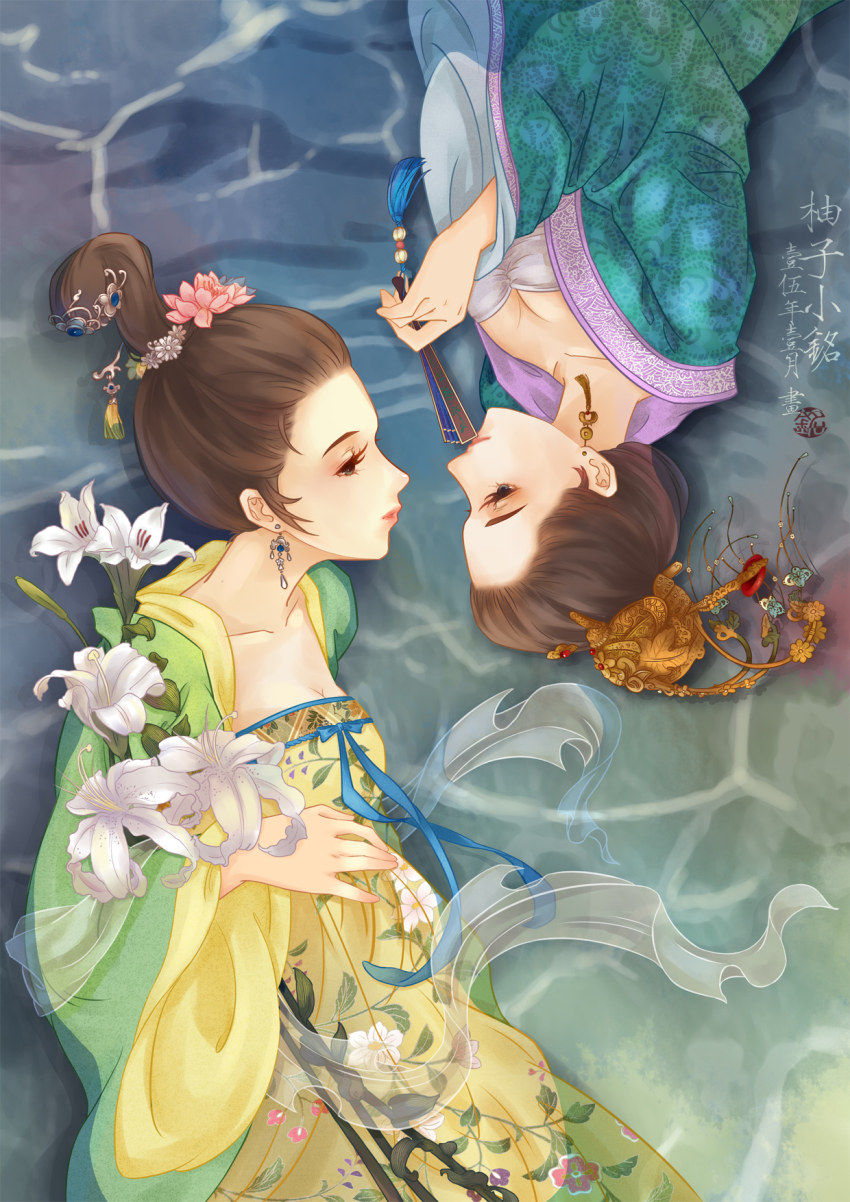 blue_eyes breasts brown_hair chinese_clothes cleavage daxiushan eye_contact flower folding_fan hand_fan hanfu highres in_water lily_(flower) looking_at_another lying on_side original partially_submerged qixiong_ruqun rotational_symmetry upside-down water white_flower youzixiaoming yuri