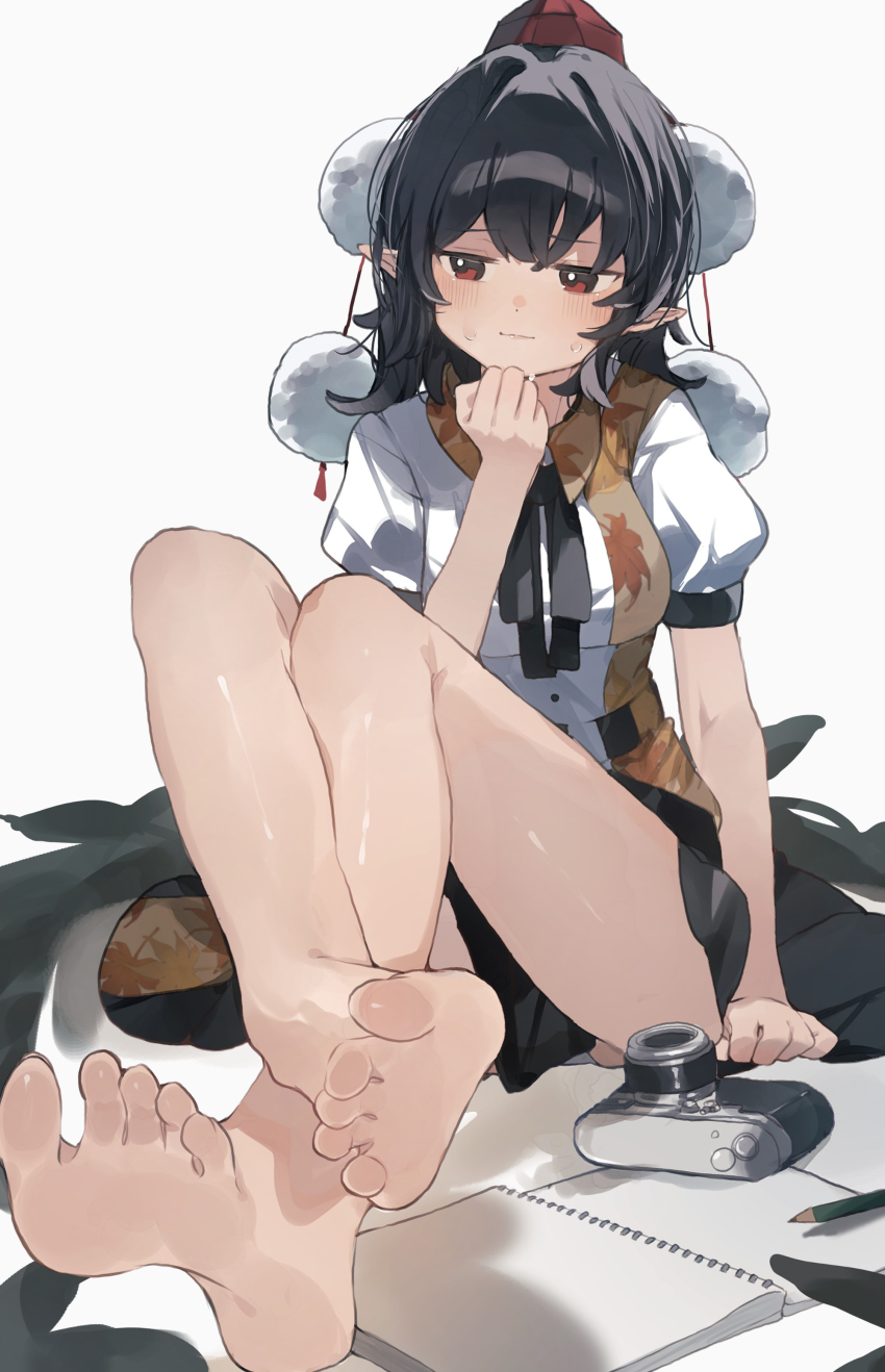 1girl absurdres bare_legs barefoot black_hair black_ribbon black_skirt black_wings breasts camera crossed_ankles feathered_wings feet hat higa_(gominami) highres medium_breasts neck_ribbon pencil pointy_ears pom_pom_(clothes) puffy_short_sleeves puffy_sleeves red_eyes ribbon shameimaru_aya shirt short_sleeves simple_background sitting sketchbook skirt soles solo sweatdrop toes tokin_hat touhou white_background white_shirt wings