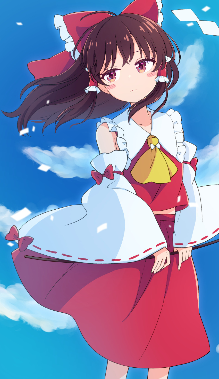 1girl absurdres ascot blue_sky bow brown_hair cloud day detached_sleeves frills hair_bow hair_tubes hakurei_reimu haruki_reimari highres long_hair looking_at_viewer red_bow red_eyes red_skirt ribbon-trimmed_sleeves ribbon_trim sidelocks skirt skirt_set sky solo standing touhou wide_sleeves yellow_ascot