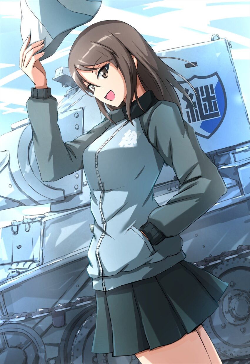 1girl black_skirt blue_hat blue_jacket brown_eyes brown_hair bt-42 commentary cowboy_shot day emblem girls_und_panzer hand_in_pocket hat highres holding holding_hat holding_unworn_clothes jacket keizoku_(emblem) keizoku_military_uniform long_hair long_sleeves looking_at_viewer mika_(girls_und_panzer) military_uniform military_vehicle miniskirt motor_vehicle omachi_(slabco) open_mouth outdoors pleated_skirt raglan_sleeves skirt smile solo standing tank track_jacket tulip_hat