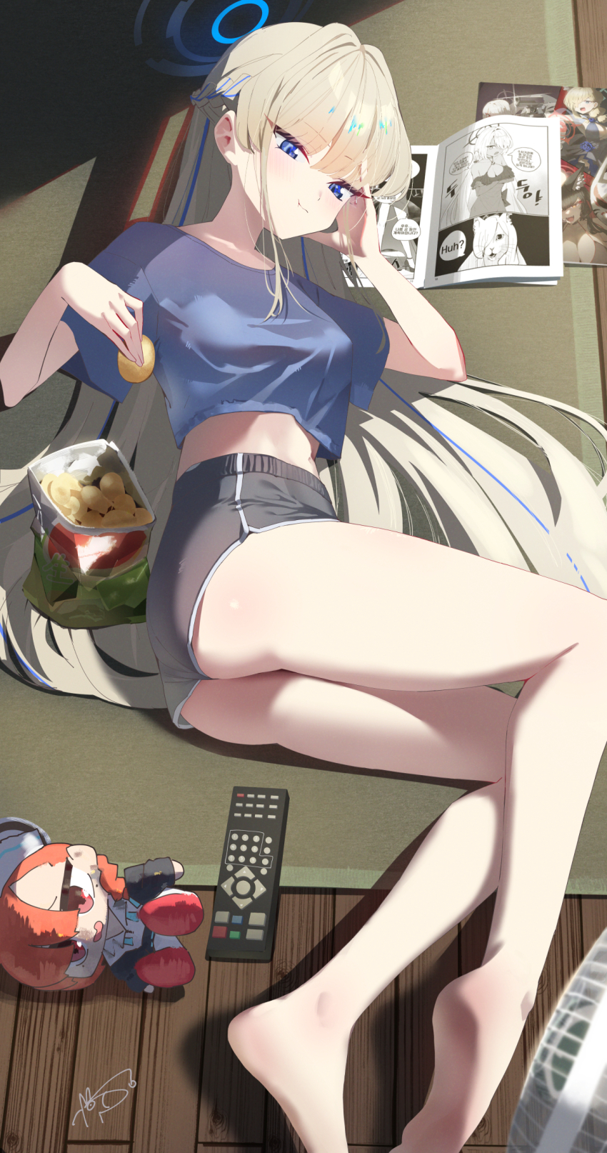 1girl alternate_costume ass black_shorts blonde_hair blue_archive blue_eyes blue_halo blue_shirt casual character_doll chips_(food) commentary_request controller crop_top dan_nako dolphin_shorts electric_fan eyelashes food halo head_rest highres holding holding_food iori_(blue_archive) kanna_(blue_archive) lying manga_(object) mat midriff navel neru_(blue_archive) on_side potato_chips remote_control shirt short_sleeves shorts stomach toki_(blue_archive) wakamo_(blue_archive) wooden_floor