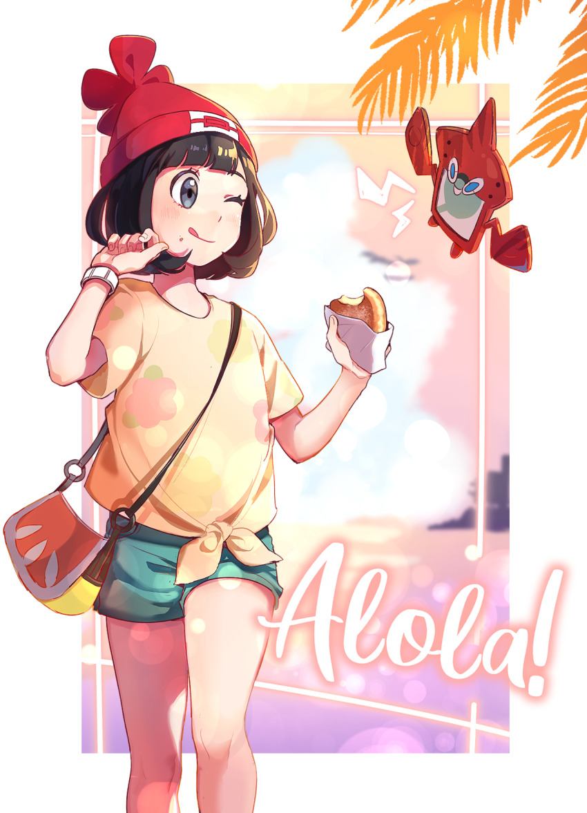 1girl ;q bag beanie black_hair blush cheese_(yongggam) closed_mouth commentary creatures_(company) floral_print food game_freak gen_4_pokemon green_shorts grey_eyes hands_up hat highres holding holding_food nintendo one_eye_closed palm_leaf pokemon pokemon_(creature) pokemon_sm red_hat rotom rotom_dex selene_(pokemon) shirt short_hair short_shorts short_sleeves shorts smile tied_shirt tongue tongue_out yellow_shirt