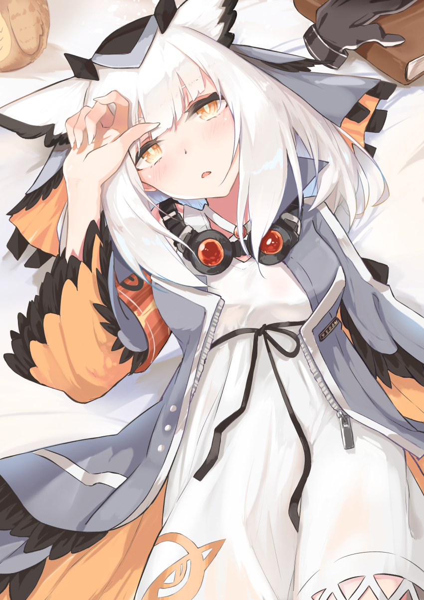 1girl absurdres arknights armband bed blush book coat commentary fingernails gloves goggles goggles_around_neck grey_coat highres kashiyarrm long_hair long_sleeves looking_at_viewer lying on_back open_mouth orange_eyes owl_ears ptilopsis_(arknights) rhine_lab_logo single_glove solo white_hair