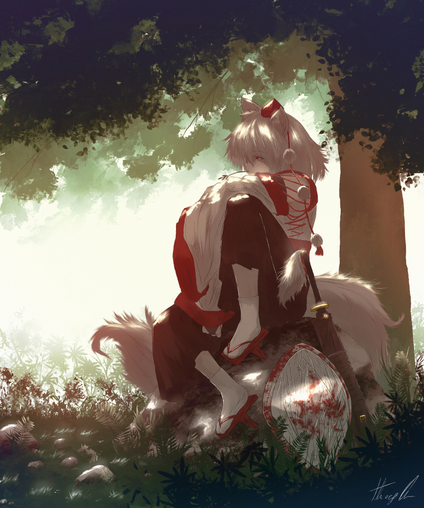 1girl absurdres animal_ears dappled_sunlight day detached_sleeves geta grass hakama hakama_pants hat highres inubashiri_momiji japanese_clothes knee_up long_bangs long_tail medium_hair mixed-language_commentary mouth_hold oubachiago outdoors pale_skin pants pom_pom_(clothes) procreate_(medium) red_eyes scabbard sheath shield sitting sleeves_past_fingers sleeves_past_wrists solo stalk_in_mouth sunlight sword tail tengu-geta tokin_hat touhou tree tree_shade under_tree weapon white_hair wide_sleeves wolf_ears wolf_girl wolf_tail