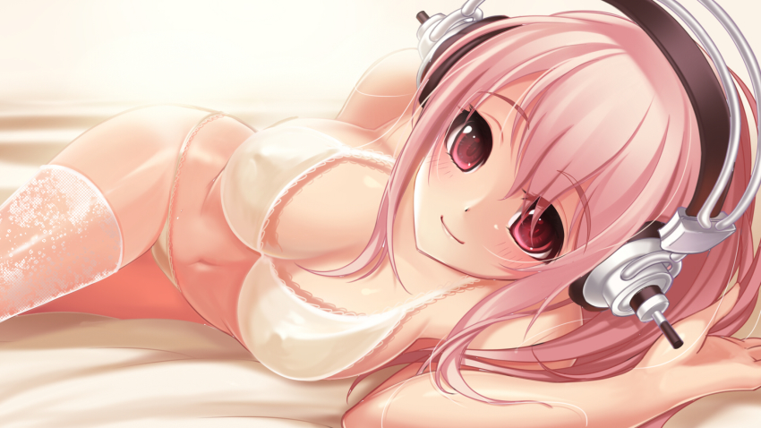 1girl bad_id bad_pixiv_id blush breasts female_focus headphones highres kaka_cheung large_breasts long_hair lying navel nitroplus on_side pink_hair red_eyes smile solo super_sonico thighhighs underwear