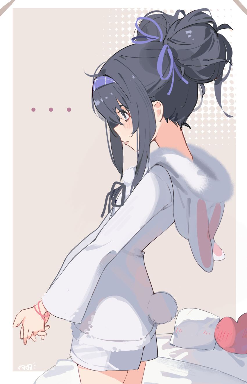 ... 1girl absurdres alternate_costume alternate_hairstyle animal_hood bed bilibalakonglijiwa black_eyes black_hair blue_archive blush closed_mouth commentary_request double_bun fake_tail hair_bun heart heart-shaped_pillow highres hood hoodie long_sleeves looking_to_the_side own_hands_together pillow profile rabbit_tail solo tail ui_(blue_archive) white_hoodie