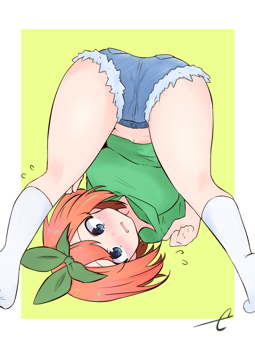 ass blue_eyes blue_shorts blush commentary_request cutoffs denim denim_shorts eyebrows_hidden_by_hair feet_out_of_frame flying_sweatdrops go-toubun_no_hanayome green_background green_hoodie green_ribbon highres hood hood_down hoodie kneepits kujou_karasuma nakano_yotsuba no_shoes nose_blush orange_hair parted_lips ribbon short_shorts shorts signature socks solo two-tone_background upside-down wavy_mouth white_background white_socks