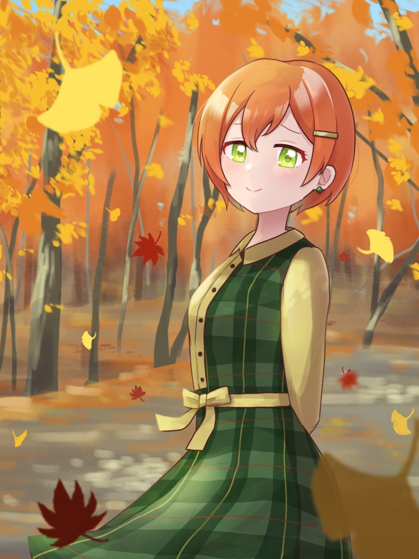 1girl absurdres arms_behind_back autumn autumn_leaves closed_mouth collared_dress commentary_request cowboy_shot diamond_earrings dress earrings falling_leaves green_dress green_eyes hair_ornament hairclip highres hoshizora_rin jewelry leaf love_live! love_live!_school_idol_project miyaco_(shirataki_168) orange_hair outdoors plaid_clothes plaid_dress short_hair smile solo split_mouth tree yellow_sleeves