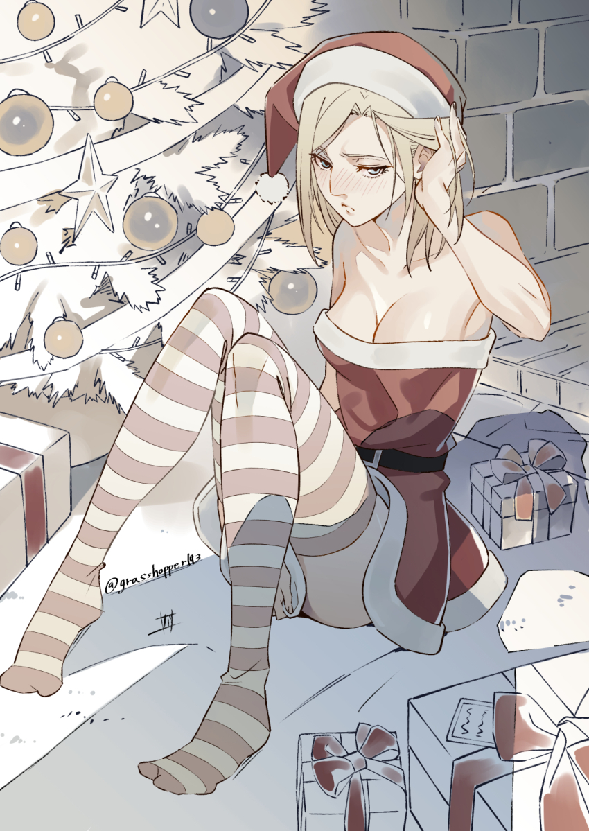 1girl adjusting_hair annie_leonhart arm_up bare_shoulders belt blonde_hair blue_eyes blush breasts christmas_tree cleavage closed_mouth collarbone commentary commentary_request curtained_hair dress dress_tug embarrassed gift grasshopper193 hat highres knees_up looking_at_viewer medium_breasts medium_hair nose_blush pink_thighhighs red_dress red_hat santa_costume santa_dress santa_hat shingeki_no_kyojin sitting solo strapless strapless_dress striped_clothes striped_thighhighs thighhighs twitter_username two-tone_thighhighs white_thighhighs