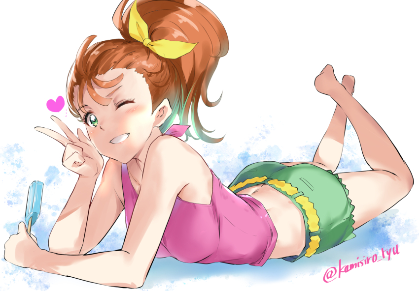 1girl ass barefoot food green_eyes green_shorts grin hair_ribbon heart highres holding holding_food holding_popsicle kamishiro_ryuu legs_up looking_at_viewer lying midriff natsuumi_manatsu on_stomach one_eye_closed orange_hair pink_tank_top ponytail popsicle precure ribbon shorts smile tank_top tropical-rouge!_precure v yellow_ribbon