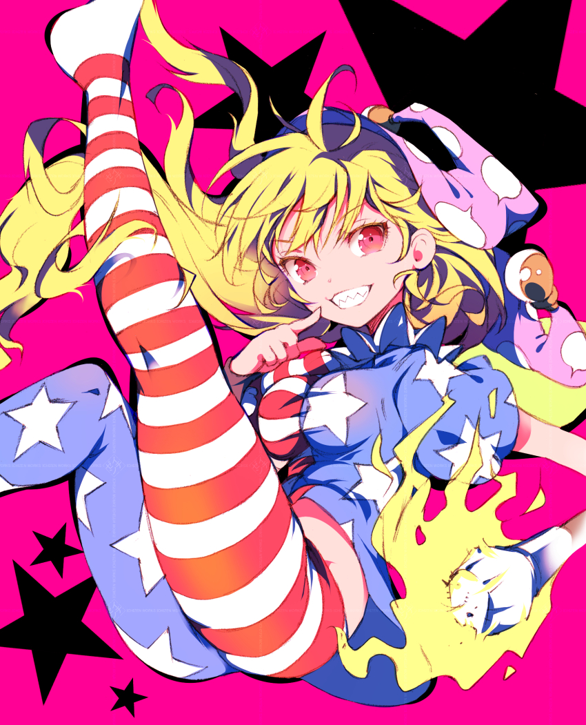 1girl american_flag_dress american_flag_legwear blonde_hair clownpiece hat highres holding holding_torch ichizen_(o_tori) long_hair no_shoes pink_background polka_dot_headwear purple_hat red_eyes sharp_teeth smile solo teeth torch touhou