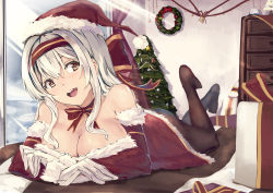  1girl bell black_pantyhose breasts brown_eyes christmas christmas_tree cleavage dress gloves hairband hat highres kantai_collection long_hair looking_at_viewer lying on_stomach open_mouth pantyhose red_dress santa_costume santa_hat senwa shoukaku_(kancolle) silver_hair smile solo sunlight 