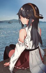  1girl bare_shoulders black_hair black_thighhighs boat brown_eyes detached_sleeves hair_ornament hairclip hakama hakama_short_skirt hakama_skirt haruna_(kancolle) haruna_kai_ni_(kancolle) headgear highres japanese_clothes kantai_collection long_hair looking_at_viewer looking_back miron_(mirona33) nontraditional_miko ocean photo_background red_hakama red_skirt ribbon-trimmed_sleeves ribbon_trim sitting skirt smile solo thighhighs watercraft 