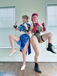  2girls ass bare_shoulders blue_eyes braid cammy_white cammy_white_(cosplay) capcom china_dress chinese_clothes chun-li chun-li_(cosplay) clenched_hands cosplay curvy dress hat highleg highleg_leotard highres huge_ass indoors jessicatalystic kicking leg_lift leg_up legs_apart leotard long_hair looking_at_viewer multiple_girls musclemommycosplay photo_(medium) pink_hair real_life shiny_clothes skindentation sleeveless smile standing standing_on_one_leg street_fighter twin_braids wide_hips 