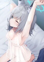  1girl absurdres alternate_costume animal_ear_fluff animal_ears arm_up armpits babydoll barefoot bed_sheet blue_archive blue_eyes blue_halo breasts commentary_request from_above grey_hair halo highres making-of_available medium_breasts medium_hair on_bed one_eye_closed outstretched_arm sasakichi_(ssk_chi) see-through shiroko_(blue_archive) sitting solo variant_set waking_up wolf_ears 