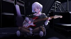  1girl absurdres amplifier bang_dream! bang_dream!_it&#039;s_mygo!!!!! black_footwear black_pantyhose black_shirt blue_eyes bra_strap closed_mouth commentary converse crossed_legs electric_guitar english_commentary full_body guitar guitar_case heterochromia highres holding holding_guitar holding_instrument holding_plectrum ichi_(bttrfl1es) indoors instrument instrument_case kaname_raana layered_sleeves long_hair long_sleeves pantyhose playing_guitar plectrum shirt shoes short_over_long_sleeves short_sleeves sitting smile sneakers solo white_hair yellow_eyes 