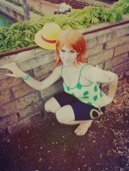  1girl camisole cosplay hat nami_(one_piece) nami_(one_piece)_(cosplay) one_piece orange_hair photo_(medium) sandals short_hair shorts solo straw_hat  rating:Sensitive score:2 user:Eindragon