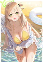  1girl absurdres bare_shoulders beach bikini blue_archive blush breasts cleavage collarbone collared_shirt commentary dress_shirt green_eyes hair_bun halo highres huge_breasts innertube kakumayu light_brown_hair long_hair long_sleeves looking_at_viewer nonomi_(blue_archive) nonomi_(swimsuit)_(blue_archive) official_alternate_costume open_mouth shirt shore single_side_bun smile solo swim_ring swimsuit thighs wet white_shirt 