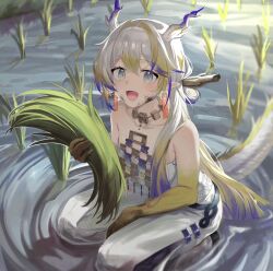  1girl absurdres arknights bare_shoulders blonde_hair collarbone commentary dragon_girl dragon_horns dragon_tail earrings grey_eyes grey_hair hair_intakes highres holding holding_plant horns jewelry long_hair looking_at_viewer looking_up multicolored_hair open_mouth outdoors pants plant pointy_ears purple_hair red_pupils rice_paddy shu_(arknights) solo strapless symbol-only_commentary tail tube_top water white_pants white_tube_top zapik 