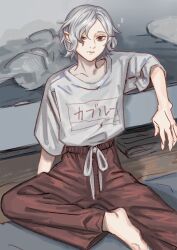  1boy bags_under_eyes barefoot bed black_eyes clothes_writing drawstring dungeon_meshi elf grey_hair indoors kabe_piko lazy_eye male_focus mithrun notched_ear on_floor pants pointy_ears shirt short_hair sitting solo sweatpants t-shirt uneven_eyes 