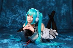  cosplay hatsune_miku hatsune_miku_cosplay lying on_stomach photo_(medium) short_twintails twintails vocaloid  rating:Sensitive score:0 user:Ouka-Chan27