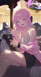  1girl absurdres bare_legs black_skirt blue_archive blurry blush bokeh camisole carousel commentary crossed_legs depth_of_field feet_out_of_frame halo highres jacket jacket_partially_removed kji_(rozo) looking_at_viewer mika_(blue_archive) miniskirt pink_hair pink_jacket scrunchie sitting skirt smile solo white_camisole wrist_scrunchie 