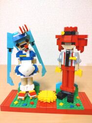  2girls alternate_costume apron black_eyes black_footwear black_necktie blue_dress blue_hair bow choroli_(chorolin) commentary crazy crazy_eyes dress drill_hair full_body gloves grey_shirt hair_bow hat hatsune_miku head_tilt highres kasane_teto lego lego_(medium) long_hair looking_at_viewer mesmerizer_(vocaloid) multiple_girls necktie open_mouth pants red_eyes red_footwear red_hair red_hat red_pants roller_skates shirt shoes short_dress short_sleeves skates sleeves_rolled_up socks standing striped_bow suspenders tongue tongue_out twin_drills twintails unconventional_media utau very_long_hair vocaloid white_apron white_socks yellow_gloves 