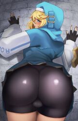  1boy against_wall ass bike_shorts black_gloves blonde_hair blue_eyes blue_hoodie blush bridget_(guilty_gear) bulge closed_mouth clothes_lift fingerless_gloves from_behind gloves grey_skirt guilty_gear guilty_gear_strive highres hood hoodie looking_at_viewer looking_back male_focus open_mouth pleated_skirt skirt skirt_lift solo sweat trap wabimochi 