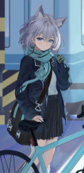  1girl animal_ear_fluff animal_ears bicycle black_bag black_skirt blue_archive blue_eyes blue_jacket blue_scarf closed_mouth commentary earrings feet_out_of_frame gloves green_gloves grey_hair hand_up highres jacket jewelry long_sleeves looking_at_viewer medium_hair naruto_maki_(naruto05) open_clothes open_jacket outdoors pleated_skirt scarf school_uniform shiroko_(blue_archive) shirt_tucked_in skirt sleeves_past_wrists socks solo standing stud_earrings white_socks wolf_ears 