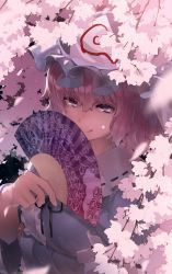 1girl :q arm_under_breasts black_ribbon blue_hat blue_kimono center_frills cherry_blossoms commentary folding_fan frilled_shirt_collar frills goshoguruma hair_between_eyes hand_fan hand_up hat highres holding holding_fan japanese_clothes kimono licking_lips looking_at_viewer mob_cap monosenbei neck_ribbon pink_eyes pink_hair purple_eyes ribbon ribbon-trimmed_collar ribbon_trim saigyouji_yuyuko saigyouji_yuyuko&#039;s_fan_design shippou_(pattern) short_hair solo tongue tongue_out touhou triangular_headpiece upper_body wide_sleeves