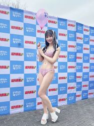  1girl balloon bikini black_hair breasts cleavage highres photo_(medium) pink_bikini sakimoto_mio swimsuit 