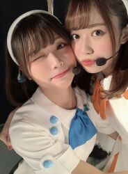  2girls date_sayuri indoors liyuu looking_at_viewer multiple_girls one_eye_closed photo_(medium) selfie smile standing voice_actor wink 