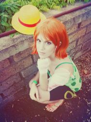 1girl camisole cosplay hat nami_(one_piece) nami_(one_piece)_(cosplay) one_piece orange_hair photo_(medium) sandals short_hair shorts solo straw_hat  rating:Sensitive score:4 user:Eindragon