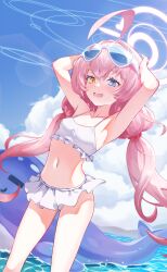  1girl :d absurdres ahoge bikini blue_archive blue_eyes blue_sky breasts cloud commentary day eyewear_on_head fang foxtail_(kxnx2574) hair_bobbles hair_ornament halo heterochromia highres hoshino_(blue_archive) hoshino_(swimsuit)_(blue_archive) inflatable_toy inflatable_whale long_hair looking_at_viewer low_twintails ocean official_alternate_costume open_mouth outdoors pink_hair pink_halo skin_fang sky small_breasts smile solo standing sunglasses swimsuit twintails white_bikini yellow_eyes 