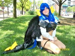  1girl arc_system_works blue_hair bow car cosplay dizzy_(guilty_gear) female_focus gears grass guilty_gear kneeling midriff motor_vehicle outdoors photo_(medium) smile tree van vehicle wings  rating:Sensitive score:7 user:OdiruVolvagia69